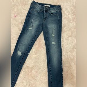 ripped low rise dark blue jeans size 1 1/2